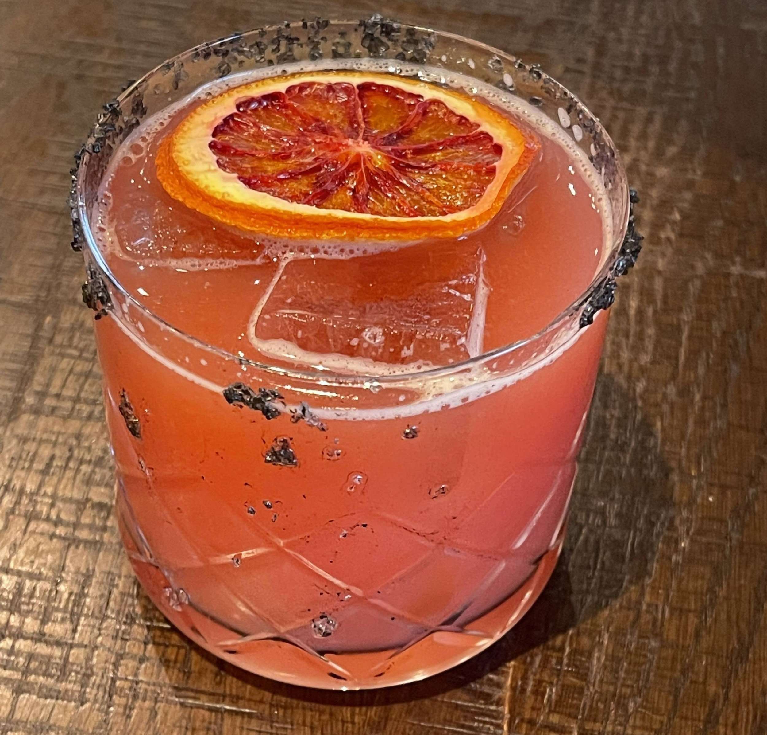 Blood orange floats in an orange vodka drink